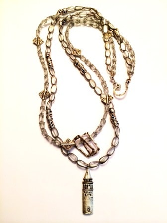 A necklace with a Galata tower pendant, designed by Şebnem Erçelik. 